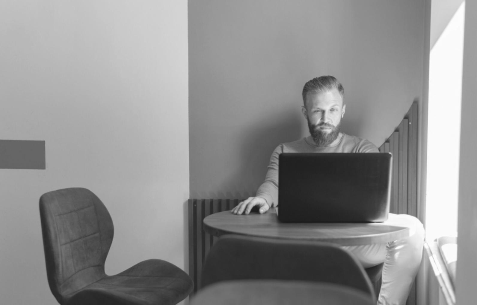 Financial analysis workspace with documents, calculator, and charts spread across a modern desk, representing comprehensive financial statement analysis services